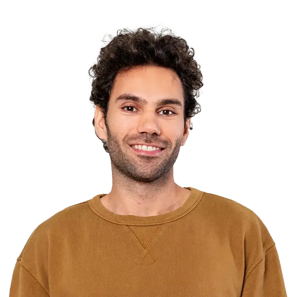Cheerful Man In Brown Sweater And Blue Jeans CU82XFN